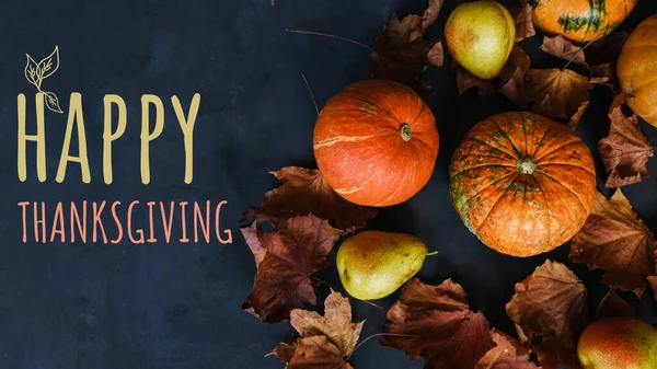 Happy thanksgiving day banner. Pumpkins, pears and autumn leaves with text happy thanksgiving.