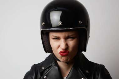 Headshot Portrait of sexy girl with red lips in black leather jacket smiling looking at camera. White background. Fashion, glamour and emotions concept clipart
