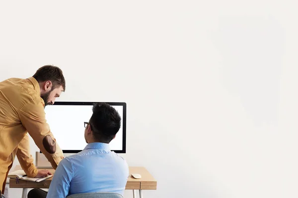 Coworking Process Businessman Desktop Connecting Networking Concept. Two confident young men looking at desktop monitor. Copy paste space mockup