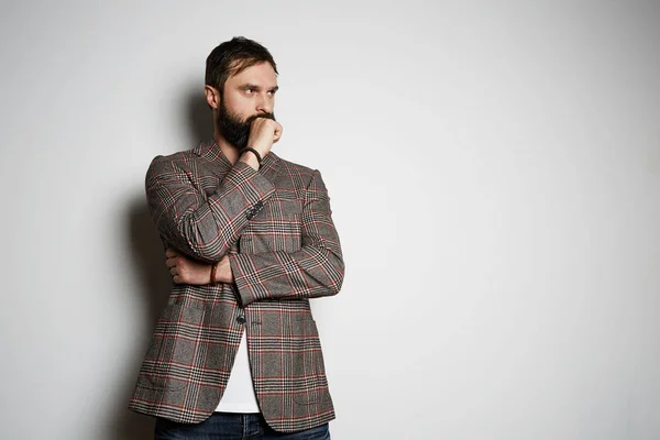 Handsome bearded businessman model poses in casual jacket and blank white t-shirt premium summer cotton, on white background. Mockup Copy Paste Advertisement. — Stock Photo, Image