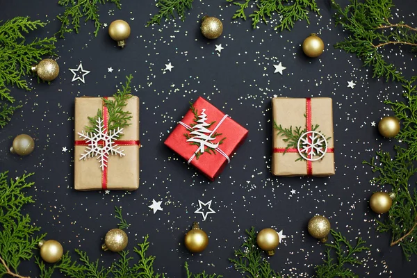Christmas handmade red gift boxes on dark background top view. Merry christmas greeting card. Happy New Year. Flat lay.