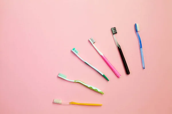 Toothbrushes on pink background — Stock Photo, Image