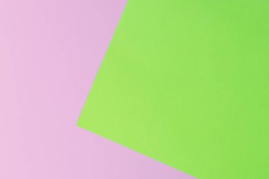 Yumuşak pembe ve yeşil kağıt doku arka plan olarak. Düz yatıyordu. En az kavramı. Yaratıcı kavramı. Pop Art.