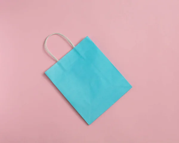 Recycle paper bag isolated on pink background. Mockup for design