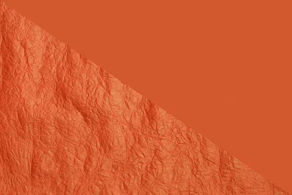 Textura de papel para fundo de duas partes na cor laranja. Estrutura de papel laranja crepe enrugado . — Fotografia de Stock