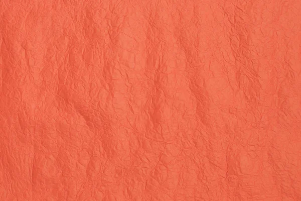 Textura de papel para fundo na cor de coral na moda. Estrutura do papel de coral crepe enrugado . — Fotografia de Stock