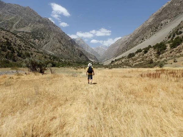 Man hiking. Wanderlust time. Man hiking in beautiful Fann mountains in Pamir, Tajikistan. Central Asia. Travel Lifestyle