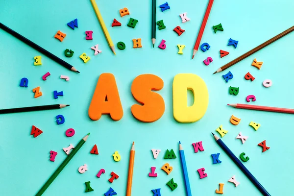 ASD. Autism spectrum disorder from color letters and color pensils, World Autism Awareness Day, April Autism awareness month