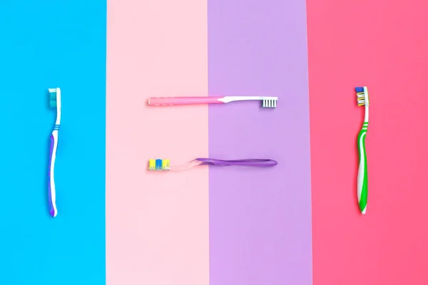 Set of different toothbrushes on color background. Hygiene of the oral cavity. — Stock Photo, Image