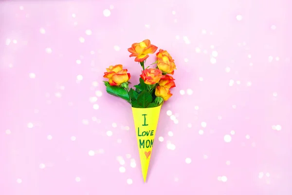 I Love my Mom concept. Flowers composition on pink background. Happy Mother\'s Day. Festive concept. LOVE MOM message