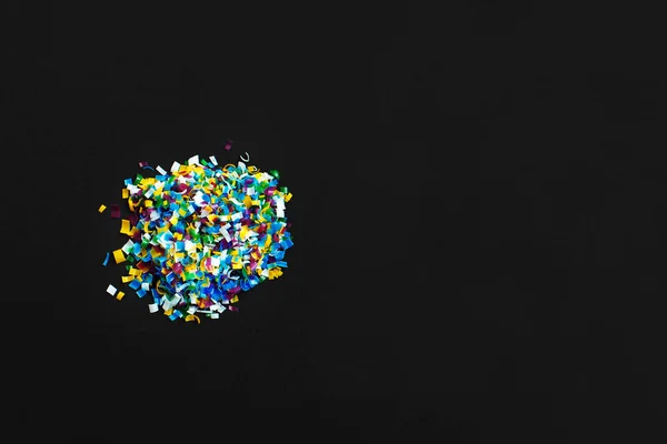 Microplastic on black background . Threat to human health and environment Dangerous additives Toxic substances. — Stock Photo, Image