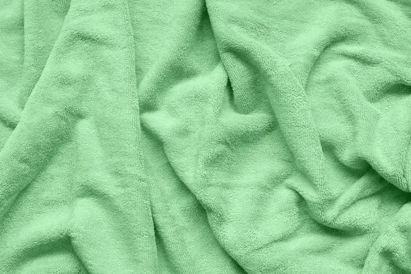 Trendy morbido tessuto color menta con onde e pieghe . — Foto Stock