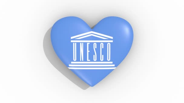 Corazón con un símbolo de la UNESCO pulsos, lazo — Vídeo de stock