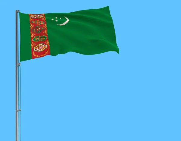 土库曼斯坦国旗上飘扬在风中的旗杆上蓝色背景 — 图库照片
