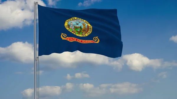 Bandera del Estado de Idaho en el viento contra el cielo nublado 3d renderizado — Foto de Stock