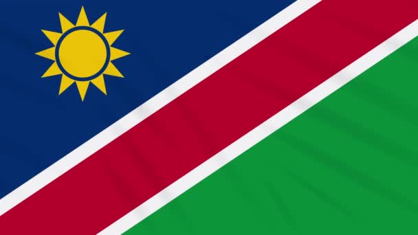 Намибия флаг размахивая тканью, фоновая петля — стоковое видео