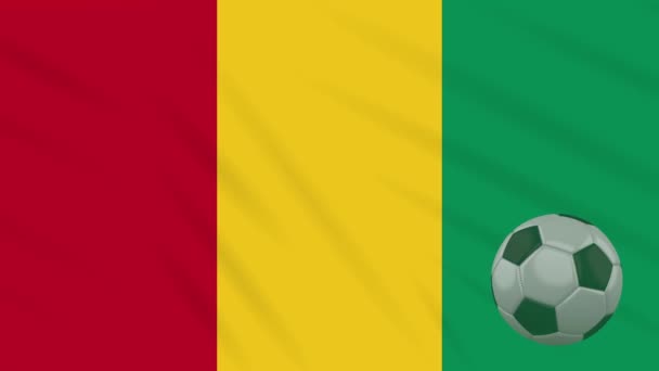 Guinea flag waving and soccer ball rotates, loop — Stock Video