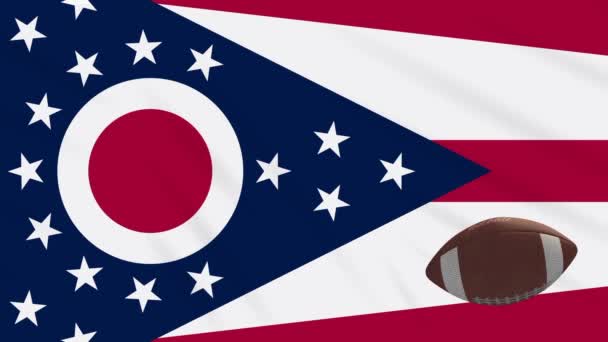 Огайо флаг размахивая и американский футбольный мяч вращается, петля — стоковое видео