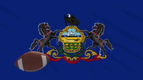 Pennsylvanie drapeau agitant et ballon de football américain tourne, boucle — Video