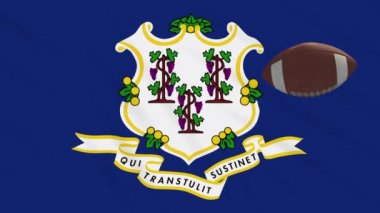 Connecticut bayrağı sallanıyor ve Amerikan futbol topu dönüyor, dönüyor