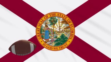 Florida bayrağı sallanıyor ve Amerikan futbol topu dönüyor, dönüyor