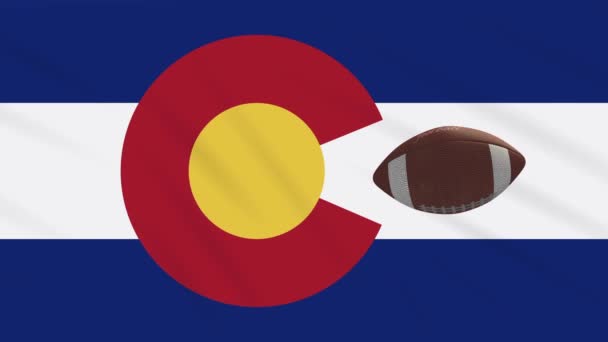 Colorado flag waving and american football ball rotates, loop — Stock Video