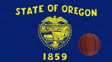 Oregon bayrağı sallanıyor ve basketbol topu dönüyor, dönüyor