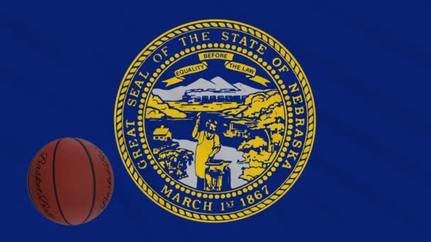 Nebraska drapeau agitant et ballon de basket tourne, boucle — Video