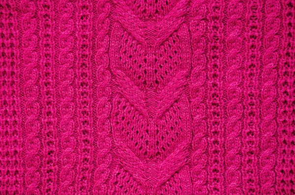 Pink knitted sweater texture background