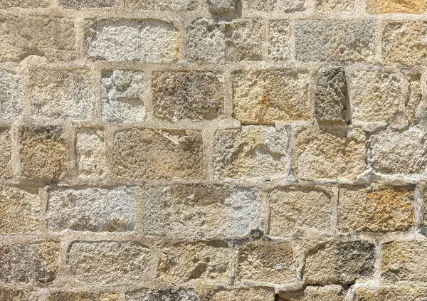 Decorative wall of colored stone bricks.