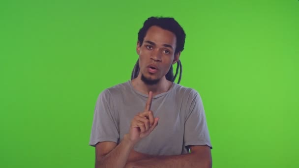 Portrait of an african american young guy saying no on the green screen — Stock Video