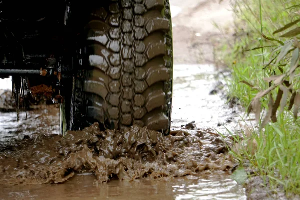 off-road car rides in a puddle