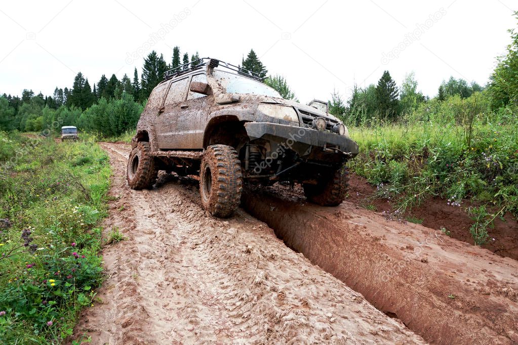 off-road car rides in a puddle