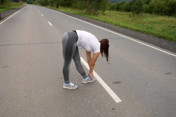 Young Girl European Appearance Goes Sports Background Forest Asphalt Road — Stock Photo, Image