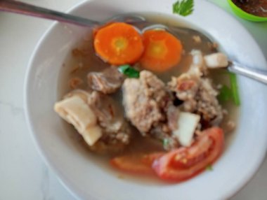 soup with chicken, vegetables and herbs