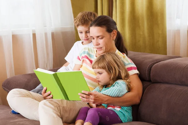 Mother Reads Book Two Her Kids Book Sofa Happy Family — Stock Photo, Image