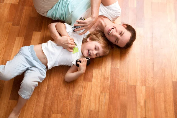 Mother Her Little Son Play Toys Car Lying Floor Room — Stock Photo, Image