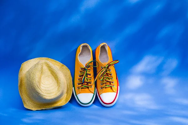 Yellow Sneakers Straw Haton Blue Background Shadows Trees Copy Space — Stock Photo, Image