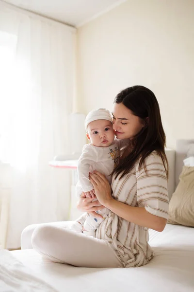 Happy Smiling Young Mother Playing Her Newborn Baby Bedroom Parenthood — Stock Photo, Image