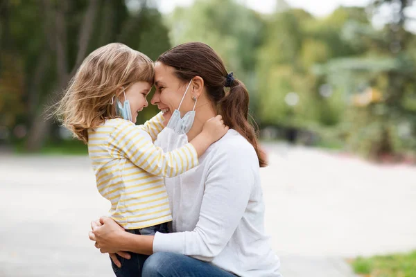 Mom Child Girl Medical Face Lowered Mask Hugging Outdoors — Stock Photo, Image