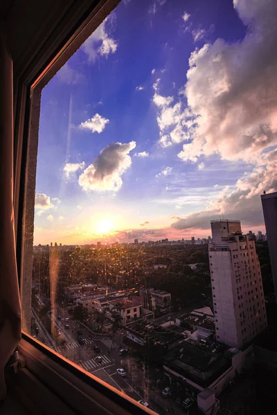 Window View to a Beautiful Sunset in So Paulo, Brazil