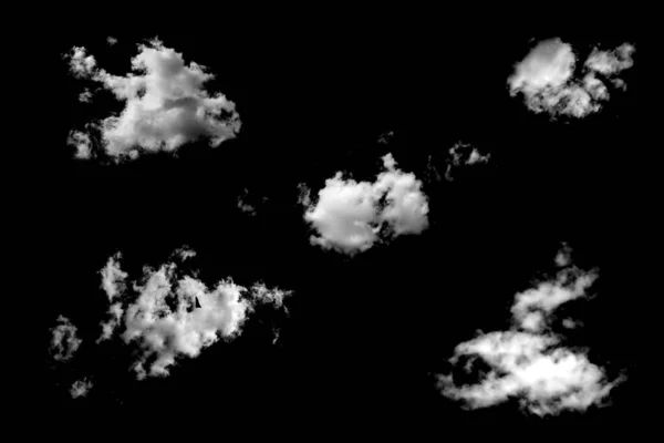 five white natural clouds isolated on a black background. object for design