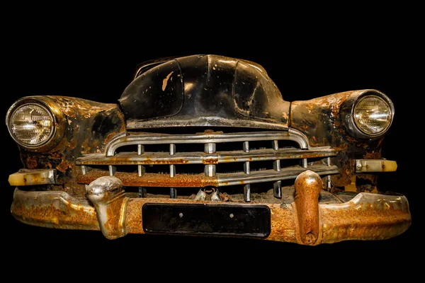 vintage rusty car isolated on black