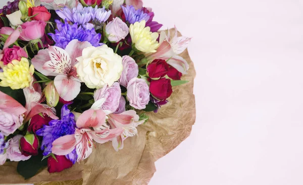 beautiful bouquet with different flowers, roses and chrysanthemums. Colorful bouquet of different fresh flowers, close-up