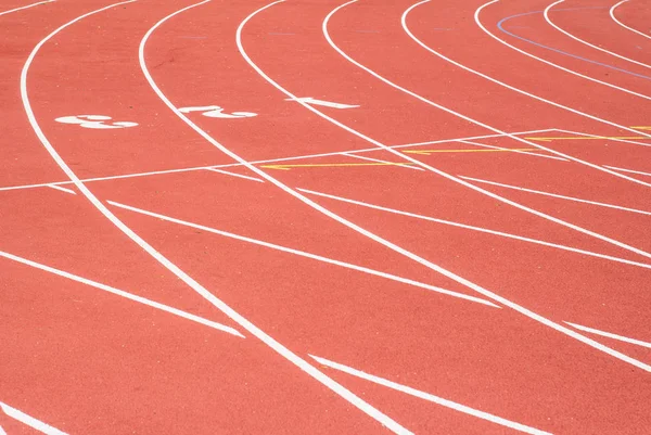 All-weather running track , orange and white lanes for running training