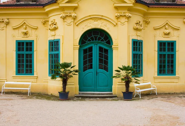 facede of old european house in yellow and turquoise colors