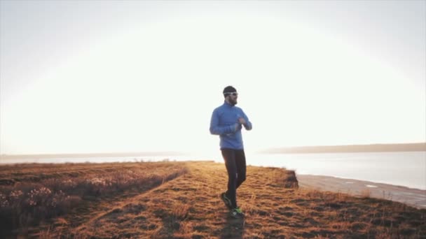 Young Male Trail Runner Training Outdoors — Stock Video