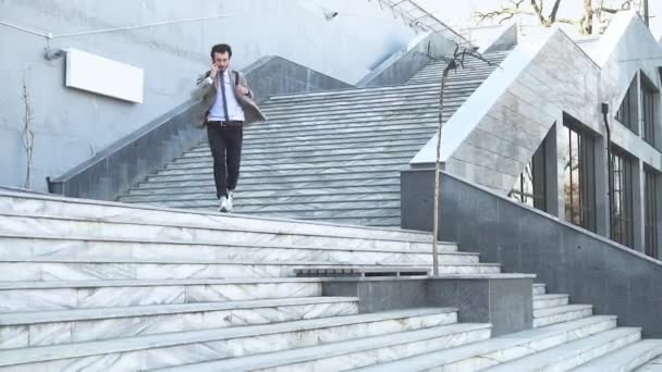 Young Male Businessman Backpack Run Stairs Outdoors Talk Cellphone — Stock Video