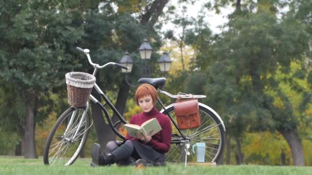 Young Woman Autumn Park Read Book Beautiful Redhead Female Bicycle — Stock Video
