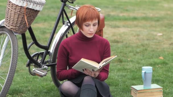 Young Woman Autumn Park Read Book Beautiful Redhead Female Bicycle — Stock Video